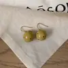 Pendientes de Botón Ovalados de Resina Transfronterizos Europeos y Americanos Pendientes Maillard de Otoño e Invierno Pendientes Simples de Moda Versátiles para Mujer Sensación de Alta Gama