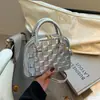 Bolsa Feminina Textura Moderna Comércio Exterior 2026 Nova Xadrez Concha Versátil Ombro Único Sobrancelha Bolsa de Mão para Senhoras