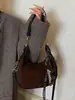Bolso de axila tipo 'dumpling' de nicho francés de alta gama transfronterizo para mujer, nuevo bolso de mano de moda, bolso de hombro versátil de estilo extranjero