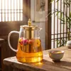 Tetera de vidrio dorada con cuerpo de vidrio transparente de borosilicato alto y filtro de acero inoxidable, adecuada para preparar tés florales en la oficina