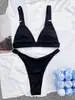 Nuevo bikini de hoyos pequeño europeo y americano color liso círculo pequeño traje de baño AliExpress bolsa triangular transfronteriza traje de baño