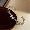Pulsera Doble Mariposa de Cristal Mariposa de Zirconia Gota de Agua Cruz Abierta de Doble Capa Brazalete Exquisita Moderna Simple Joyería para Mujer