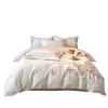 Juego de cama de lujo y elegante de cuatro piezas 100% algodón de fibra larga de Xinjiang, hecho completamente de algodón puro, con diseños florales y bordados de alta gama, adecuado para madres y bebés