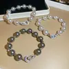 Pulsera de Perlas y Circonita Cúbica Retro Francesa Lujo Ligero Gama Alta Exquisita Cadena de Mano Estilo Elegante de Nicho Versátil para el Viaje Joyería de Mano