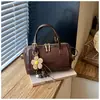 Bolso Boston de color block único, modelo nuevo 2026, bolso de mano elegante, bolso cruzado personalizado, bolso de hombro para el trabajo y los desplazamientos