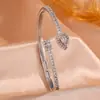 RAKOL Moda Luxo Leve Cobre Incrustado Zircônia Trevo de Quatro Folhas Aberto Ajustável Pulseira Feminina Nicho Toque de Alto Padrão Joia de Mão