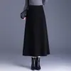 Falda versátil de color liso para mujer, nueva moda otoño e invierno 2026, de cintura alta, adelgazante, que cubre las caderas, larga, línea A, moderna