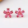 Moda coreana cobre con incrustaciones de color 3A circonio corindón rojo aretes flor simple más vendidos fabricantes aguja plata esterlina aretes femeninos