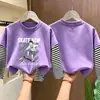 Camiseta de Manga Larga de Algodón Puro para Niños Otoño 2026 Holgada Versátil Cuello Redondo para Niños con Diseño Falso de Dos Piezas