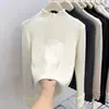 Top de capa base de alta gama con bordes rizados, cuello semi-alto, suéter de punto elegante en capas para mujer para Primavera, Otoño e Invierno 2026