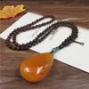 Nueva cadena de suéter de cera de abeja vieja color amarillo aceite de pollo imitación resina joyería de ámbar rosa collar largo suministro en vivo al por mayor
