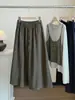 Falda versátil de color liso simple de moda estilo coreano para mujer, nueva falda de paraguas acampanada línea A de cintura alta adelgazante con cordón