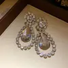 Pendientes de Plata Europeos y Americanos Transfronterizos con Incrustaciones de Diamantes en Forma de Gota Pendientes de Botón Simples de Moda Pendientes con Sentido de Diseño de Lujo Ligero de Gama Alta