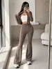 Conjunto de roupas femininas europeias e americanas para comércio exterior transfronteiriço: top cardigã curto texturizado e calça flare de cintura alta que valoriza a silhueta, conjunto de duas peças para o dia a dia