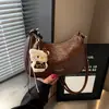 Bolso cruzado retro casual simple para debajo del brazo, nuevo bolso de mano para commuting otoño 2026, bolso versátil de hombro y cruzado