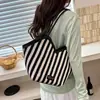 Bolso grande para mujer 2026 verano nuevo moda color liso bloques de color bolso de hombro tipo tote popular para ir al trabajo bolso de axila tipo tote