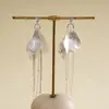 Pendientes de borla de flor de concha blanca transfronterizos europeos y americanos con perlas, pendientes de estilo de corte francés, pendientes ligeros y lujosos con un toque de alta gama