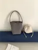 Bolso de ante para debajo del brazo de otoño e invierno, retro, estilo coreano de nicho, bolso tipo cubo cilíndrico, bolso de mano de moda transfronterizo, bolso de hombro para mujer