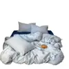 Juego de cuatro piezas de ropa de cama de algodón acolchado estilo japonés a rayas, grado A para maternidad, sábana y funda de edredón, juego de tres piezas para dormitorio de estudiante