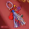 Chaveiro de Cabacinha Vermelha de Areia Crua Mineral Natural de Alto Teor com Borla Tecida à Mão Decoração Pingente Estilo Xizang