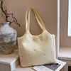 Bolso tote de diseño de nicho nuevo para mujer, bolso de hombro de gran capacidad, bolso de mano simple y casual para el trabajo, bolso cruzado ligero