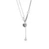Exquisita elegante cadena de clavícula de corazón de durazno tridimensional con borla de estrella versátil japonesa y coreana, diseño de nicho, collar de estilo frío