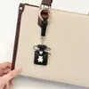 Colgante de llavero de oso con botella de perfume incrustada de diamantes de arcilla, decoración creativa linda de bolsa de fragancia pequeña con diamantes brillantes, llavero de coche