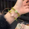 Pulsera tejida a mano de trébol de cuatro hojas, estilo nuevo 2025, estilo Ins, nicho, fresca y brillante, pulsera de amistad para parejas para mujeres, verde
