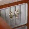 Aretes de clip de camelia blanca estilo Chanel de alta gama con circonita de perla, aretes colgantes pequeños, moda, temperamento femenino