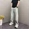 Pantalones casuales de color marrón melange de tiro alto para hombre, estilo callejero americano, adecuados para primavera y otoño, con un diseño ligeramente acampanado y pierna recta.