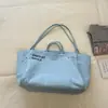 Bolsa de ombro casual de lona de grande capacidade, cor macaron, inspirada em dopamina, com letras personalizadas texturizadas