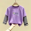 Camiseta de manga larga de algodón puro para niño 2026 primavera y otoño nueva elegante de dibujos animados estilo dos piezas falsas camiseta base de primavera para niño