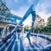 Fabricante a Medida de Esculturas Grandes de Acero Inoxidable: Fuente de Agua para Exteriores, Anillo de Onda Espejado, Marco de Corredor de Ciervos en Campus, Adorno de Paisaje