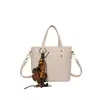 Bolsa Transversal Fashion Feminina 2026 Nova Estilosa Versátil Bolsa de Mão de Alta Qualidade Pequena Quadrada Decoração de Laço Ombro