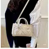 Bolso de mano de lujo de nicho para mujer, bolso tote de moda estilo coreano, bolso de hombro y cruzado acolchado de alta gama, bolso pequeño