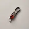 Directo de fábrica llavero de cuerda tejida accesorios de ferretería hebilla de herradura colgante para llave de coche accesorios de coche de moda