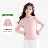 Camiseta feminina de outono e inverno com gola redonda e manga longa, feita de fio de elastano, altamente elástica, macia e confortável, adequada para usar em camadas, uso diário, ocasiões casuais e como looks combinando para pais e filhos