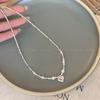 Collar de perlas de plata destrozadas de alta calidad para mujer, ligero, lujoso, con diseño de cadena de clavícula y accesorios que combinan con todo.