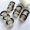 Joias de moda simples por atacado corda de pérola + strass anel de cabelo preto sem costura para rabo de cavalo de meninas anel de toalha