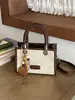 Bolso de mano vintage para otoño e invierno para mujer 2026 nuevo bolso cuadrado pequeño de gamuza esmerilada con una textura elegante, bolso de hombro y cruzado