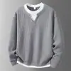 Suéter de punto para hombre de comercio exterior transfronterizo, corte holgado, imitación de dos piezas, color liso, versátil para el otoño casual, con un toque de alta gama