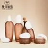 Botella de Vidrio de Alta Gama Personalizada con Dosificador para Loción 50g Color Marrón Mate Botella para Crema Portátil de Viaje Botella Vacía para Cuidado de la Piel