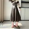 Elegante falda de PU para mujer, estilo A, otoño, nuevo modelo otoño 2026, falda de paraguas con dobladillo ancho, falda de longitud media A13512