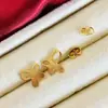Pendientes de Gancho para Oreja con Nudo Ruyi Estilo Antiguo Chapados en Latón para Mujer, Pendientes de Flor de Lirio Cisne, Pendientes de Botón de Mariposa de Gama Alta de Nicho Venta al por Mayor