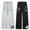 Pantalones Deportivos con Estampado Callejero Estilo Americano 11Kn para Hombres y Mujeres, Corte Holgado, Diseño Versátil de Retazos, Pantalones Casuales Rectos de Pierna Ancha