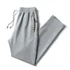 Pantalones casuales de algodón directo de fábrica para primavera y otoño, pantalones deportivos para hombre, talla grande, pantalones elásticos, pantalones de moda para hombre