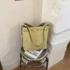 2026 Nova Bolsa de Balde Manual Escavada Oca Estilo Ins de Nicho Moda Casual Simples Ombro Transversal Bolsa Feminina