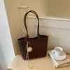 Bolso tote tejido con patrón transfronterizo para mujer, nuevo modelo de otoño 2026, sensación de lujo ligero de nicho de alta gama, bolso de hombro grande para ir al trabajo