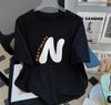 Camiseta feminina de manga curta com estampa de letras novas para o verão de 2023, branca, de comprimento médio, para todos os tipos de combinações, camiseta solta, tamanho grande