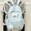 Mochila fresca y sencilla de lunares con lazo para mujer, nuevo modelo 2026, mochila versátil de gran capacidad para estudiantes de secundaria y preparatoria